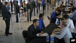 Job applicants receive interviews by Florida Marlins staff at Marlins Park in Miami, Florida, October 24, 2012.