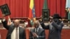 Sudan's President Omar al-Bashir, center-left, and South Sudan President Salva Kiir, right, celebrate the completion of a signing ceremony in Addis Ababa, Ethiopia, September 27, 2012.