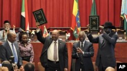 South Sudan President Salva Kiir and Sudan President Omar al-Bashir take part in signing ceremony in Addis Ababa, Ethiopia. 