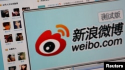 FILE - Logo of Sina Corp.'s Chinese microblogging site 'Weibo,' on a screen, Beijing, Sept. 2011.