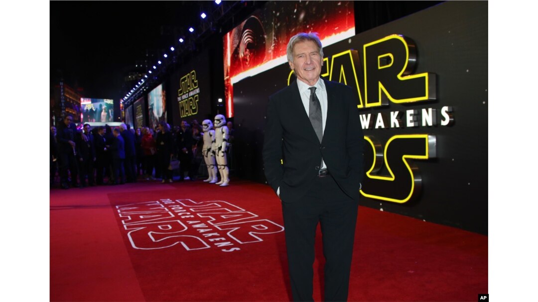 FILE - Harrison Ford poses for photographers upon arrival at the European premiere of the film 'Star Wars: The Force Awakens ' in London, Dec. 16, 2015.