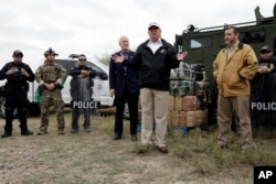 FILE - President Donald Trump speaks as Sen. John Cornyn, R-Texas, left, and Sen. Ted Cruz, R-Texas, listen, at the Rio Grande on the southern border with Mexico in McAllen, Texas, Thursday, Jan. 10, 2019.