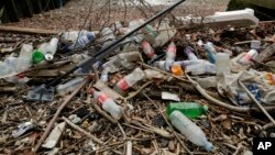 Plastic bottles and other plastics lie washed up on the north bank of the River Thames in London, Feb. 5, 2018. 