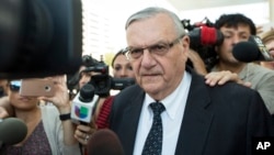 FILE - Former Sheriff Joe Arpaio leaves the federal courthouse on July 6, 2017, in Phoenix, Arizona. 
