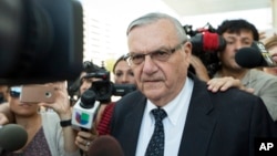 FILE - Former sheriff Joe Arpaio leaves the federal courthouse on July 6, 2017, in Phoenix, Arizona. 