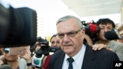 FILE - Former Sheriff Joe Arpaio leaves the federal courthouse on July 6, 2017, in Phoenix, Arizona.