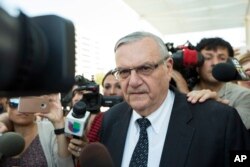 FILE - Former Sheriff Joe Arpaio leaves the federal courthouse on July 6, 2017, in Phoenix, Arizona.
