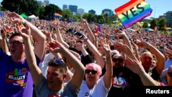 Supporters of the 'Yes' vote for marriage equality celebrate after it was announced the majority of Australians support same-sex marriage in a national survey.