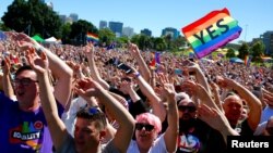 Supporters of the 'Yes' vote for marriage equality celebrate after it was announced the majority of Australians support same-sex marriage in a national survey, paving the way for legislation to make the country the 26th nation to formalize the unions by the end of the year, at a rally in central Sydney, Nov. 15, 2017. 