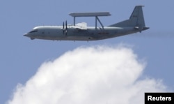 A KJ-200 surveillance aircraft of the Chinese Air Force flies during a training session, July 2, 2015.