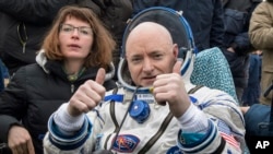 FILE - In this March 2, 2016, photo provided by NASA, International Space Station crew member Scott Kelly of the U.S. reacts after landing near the town of Dzhezkazgan, Kazakhstan.