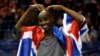 FILE - Britain's Mo Farah celebrates winning the Men's 5000m Action at the Birmingham Indoor Grand Prix, Barclaycard Arena, Feb. 18, 2017. 