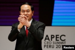 Vietnam's President Tran Dai Quang gestures during a meeting of the Asia-Pacific Economic Cooperation CEO Summit in Lima, Peru, Nov. 19, 2016.