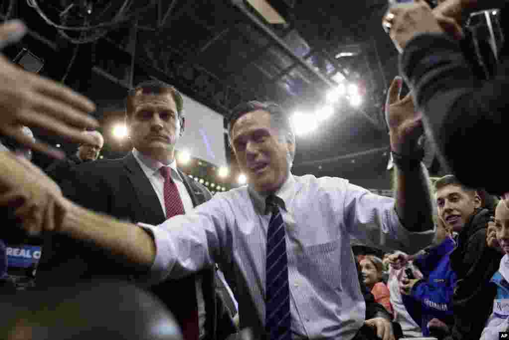Republican presidential candidate and former Massachusetts Gov. Mitt Romney greets supporters at a New Hampshire campaign rally at Verizon Wireless Arena in Manchester, New Hampshire, Nov. 5, 2012. 