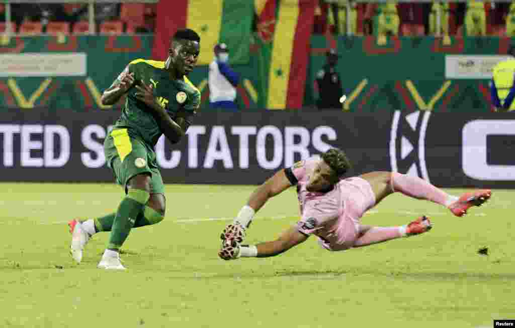 Senegal&#39;s Bamba Dieng scores their second goal of the match against Cape Verde in Cameroon, Jan. 25, 2022.