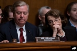 Senate Judiciary Committee Chairman Lindsey Graham, R-S.C., left, and Sen. Dianne Feinstein, D-Calif., the ranking member, prepare to take a break during questioning of Attorney General William Barr about special counsel Robert Mueller's Russia report, on Capitol Hill in Washington, May 1, 2019.