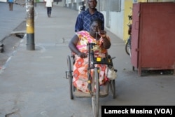 Fanny Banda in the wheelchair, says begging is a humiliating experience but she does it because of poverty.
