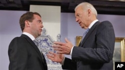 Vice President of the United States Joe Biden, right, speaks to Russian President Dmitry Medvedev during their meeting at the Gorky presidential residence outside Moscow, March 9, 2011