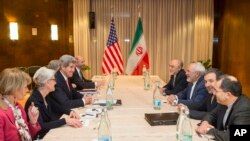 U.S. Secretary of State John Kerry, third from left, meets with Iranian Foreign Minister Mohammad Javad Zarif, third from right, for a new round of nuclear negotiations Wednesday, March 4, 2015.