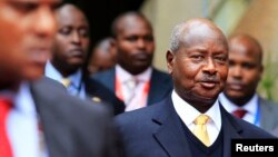 FILE - Uganda's President Yoweri Museveni (front R) arrives for the Heads of States and Governments International Conference on the Great Lakes Region in Nairobi, July 31, 2013. 