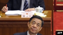In a file picture taken on March 5, 2012, Chongqing mayor Bo Xilai (bottom C) attends the opening session of the National People's Congress (NPC) at the Great Hall of the People in Beijing.
