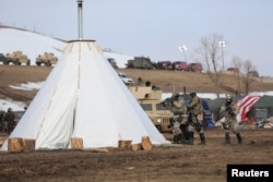 Police attempt to clear the Oceti Sakowin camp in Cannon Ball, North Dakota, U.S., February 23, 2017.