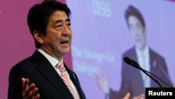 Japan's Prime Minister Shinzo Abe delivers the opening keynote address for the 13th International Institute for Strategic Studies (IISS) Asia Security Summit: The Shangri-La Dialogue, in Singapore May 30, 2014.