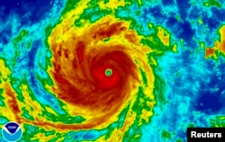 Super Typhoon Soudelor is seen in an enhanced infrared NOAA satellite image taken in the Western Pacific Ocean at 08:32 ET (12:32 GMT) August 4, 2015. Soudelor, deemed the strongest storm of 2015,
