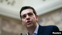 Greek Prime Minister Alexis Tsipras addresses members of his leftist Syriza party in the parliament Feb. 17, 2015. 