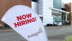 A sign at a Chicago grocery store advertises the availability of jobs Oct. 8, 2021.