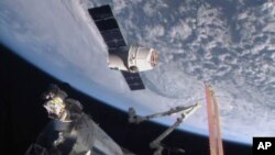 FILE - In this April 17, 2015, image from NASA-TV, the SpaceX Dragon 6 resupply capsule nears the International Space Station. 