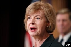 FILE - Sen. Tammy Baldwin, D-Wis., speaks about President Donald Trump's first 100 days, during a media availability on Capitol Hill in Washington, D.C., April 25, 2017.