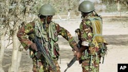 Kenyan soldiers talk as they prepare to advance near Liboi in Somalia (File)