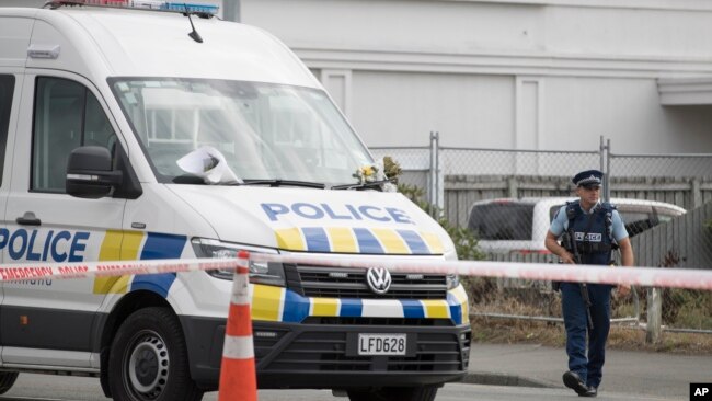 A police officer stands guard outside the Linwood mosque in Christchurch, New Zealand, March 19, 2019.