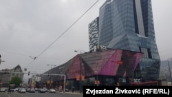 Large shopping center in Sarajevo with huge neon advertising