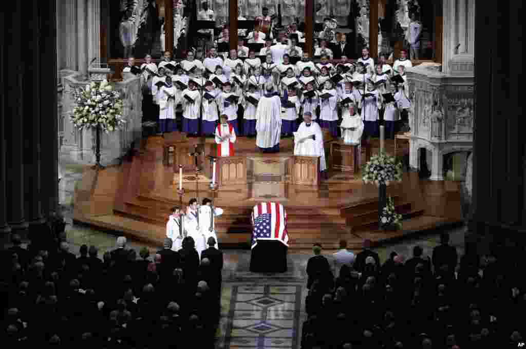 The choir sings at a memorial service for Sen. John McCain, at Washington National Cathedral in Washington, Sept. 1, 2018.