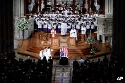 The choir sings at a memorial service for Sen. John McCain, at Washington National Cathedral in Washington, Sept. 1, 2018.