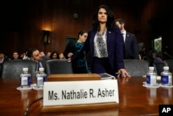 Department of Homeland Security Acting Executive Associate Director of Enforcement and Removal Operations Nathalie Asher arrives to testify during a Senate Judiciary Border Security and Immigration Subcommittee hearing about the border, May 8, 2019.