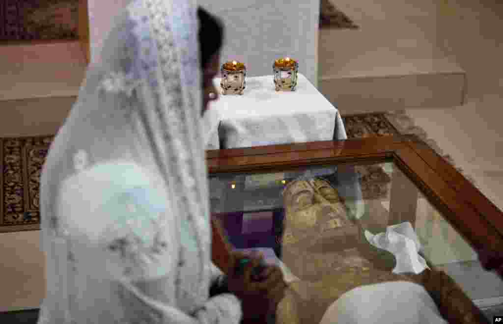 An Indian Christian prays at Our Lady of Lourdes Church on Good Friday in Hyderabad, India, March 29, 2013.