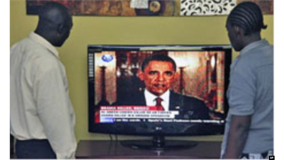 Kenyans in Nairobi watch President Obama announce the death of bin Laden.