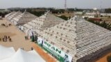 This aerial view shows bags of rice at the launch of the largest rice pyramids in Abuja, Nigeria, on Jan. 18, 2022. 
