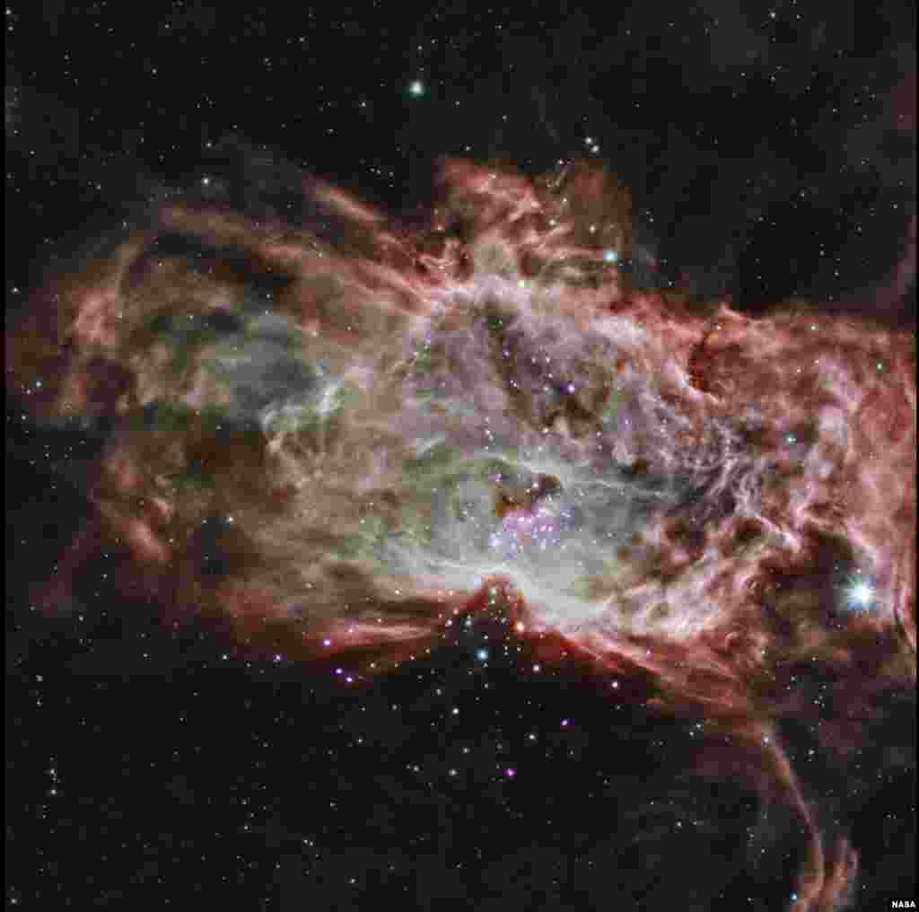 This composite image shows one of the clusters, NGC 2024, which is found in the center of the so-called Flame Nebula about 1,400 light years from Earth. In this image, X-rays from Chandra are seen as purple, while infrared data from NASA&#39;s Spitzer Space Telescope are colored red, green, and blue. Astronomers have studied two star clusters and the results show that the simplest ideas for the birth of these clusters cannot work.