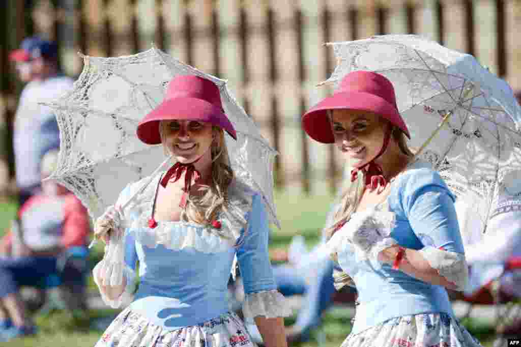 Twins travel down the parade route during the annual Twins Days Festival in Twinsburg, Ohio, Aug. 5, 2017.