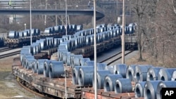 Steel coils sit on wagons when leaving the thyssenkrupp steel factory in Duisburg, Germany, March 2, 2018. President Donald Trump risks sparking a trade war with his closest allies if he goes ahead with plans to impose steep tariffs on steel and aluminum imports, German officials and industry groups warned. 