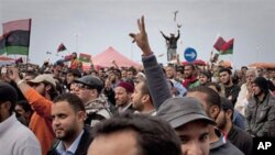 Libyan people celebrate in the main square of Benghazi, eastern Libya, March 18, 2011