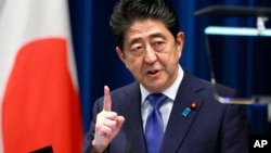 Japan's Prime Minister Shinzo Abe speaks during a press conference at the prime minister's official residence in Tokyo, Sept. 25, 2017.