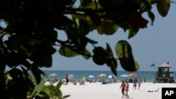 FILE - This May 18, 2011 file photo shows the Siesta Key public beach in Sarasota, Fla. 