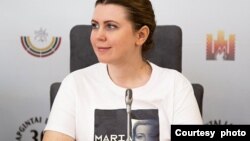 Dovile Sakaliene, co-chair of the delegation of Lithuanian lawmakers at IPAC, seen wearing a T-shirt in support of Maria Kalesnikava, political prisoner in Belarus. (Dovile Sakaliene/Twitter)