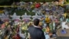 FILE - A man prays at a makeshift memorial outside the Tree of Life synagogue following the Oct. 27, 2018, shooting at the house of worship in Pittsburgh, Pennsylvania, Oct. 31, 2018. 