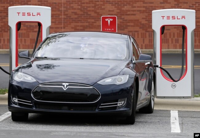 A Telsa car recharges at a Tesla charging station in Charlotte, North Carolina, June 24, 2017.